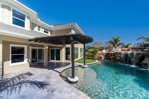 Backyard pool with deck and outdoor entertaining area — Hernando County, FL